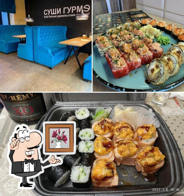 Это снимок, где изображены внутреннее оформление и еда в Суши Гурмэ