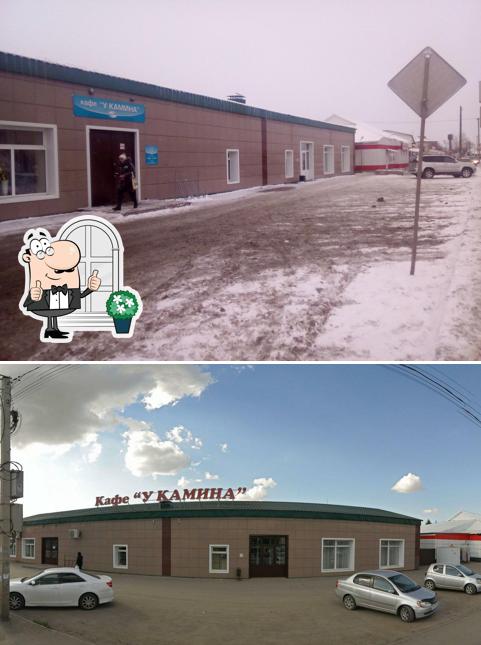 У камина