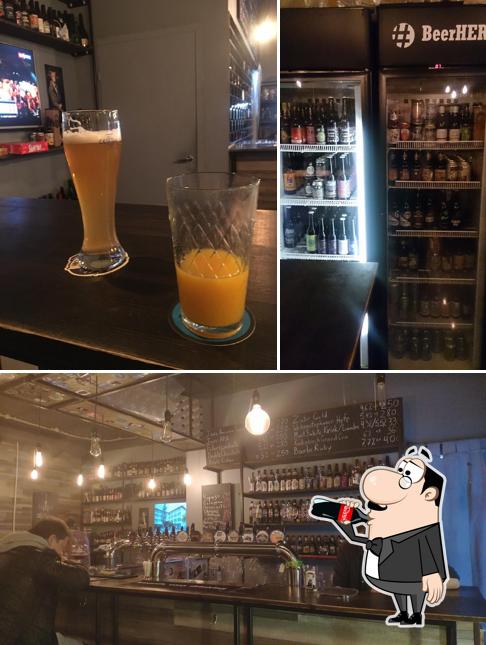 Это фотография, где изображены напитки и барная стойка в BeerHere