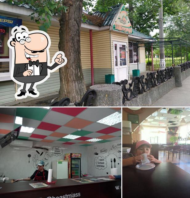 Посмотрите на эту фотографию, где видны внутреннее оформление и внешнее оформление в Гамбургерная