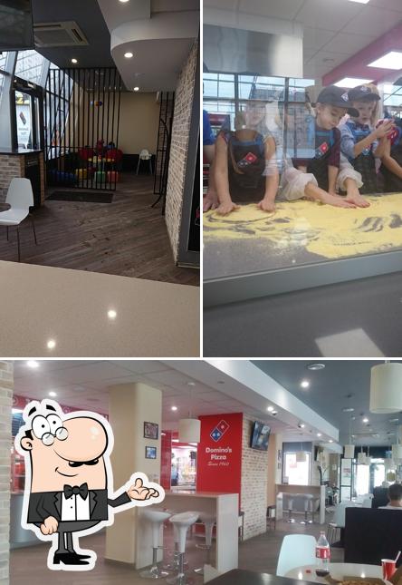 Посмотрите на внутренний интерьер "Domino’s Pizza"