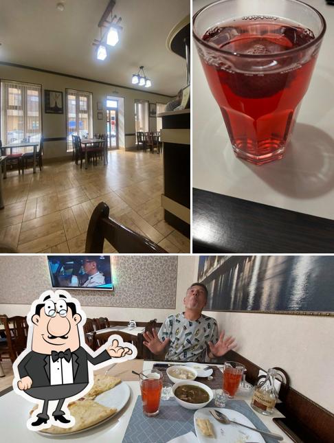 Фото, на котором видны внутреннее оформление и напитки в Кошка