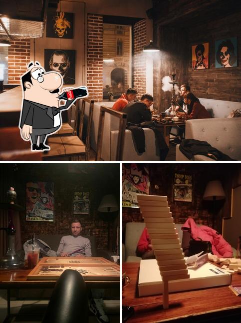 Снимок, на котором видны напитки и внутреннее оформление в Old School Smoky Loft