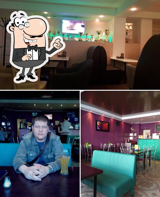 Это фотография, где изображены внутреннее оформление и барная стойка в Академия